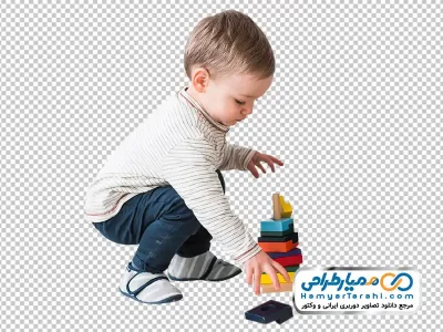 تصویر png پسر بچه در حال بازی با تکه های پازل